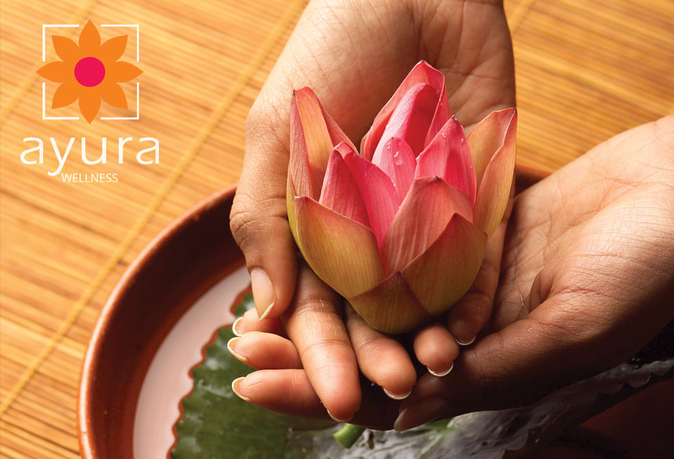 lotus in hands at ayura spa,cardamom county, thekkady