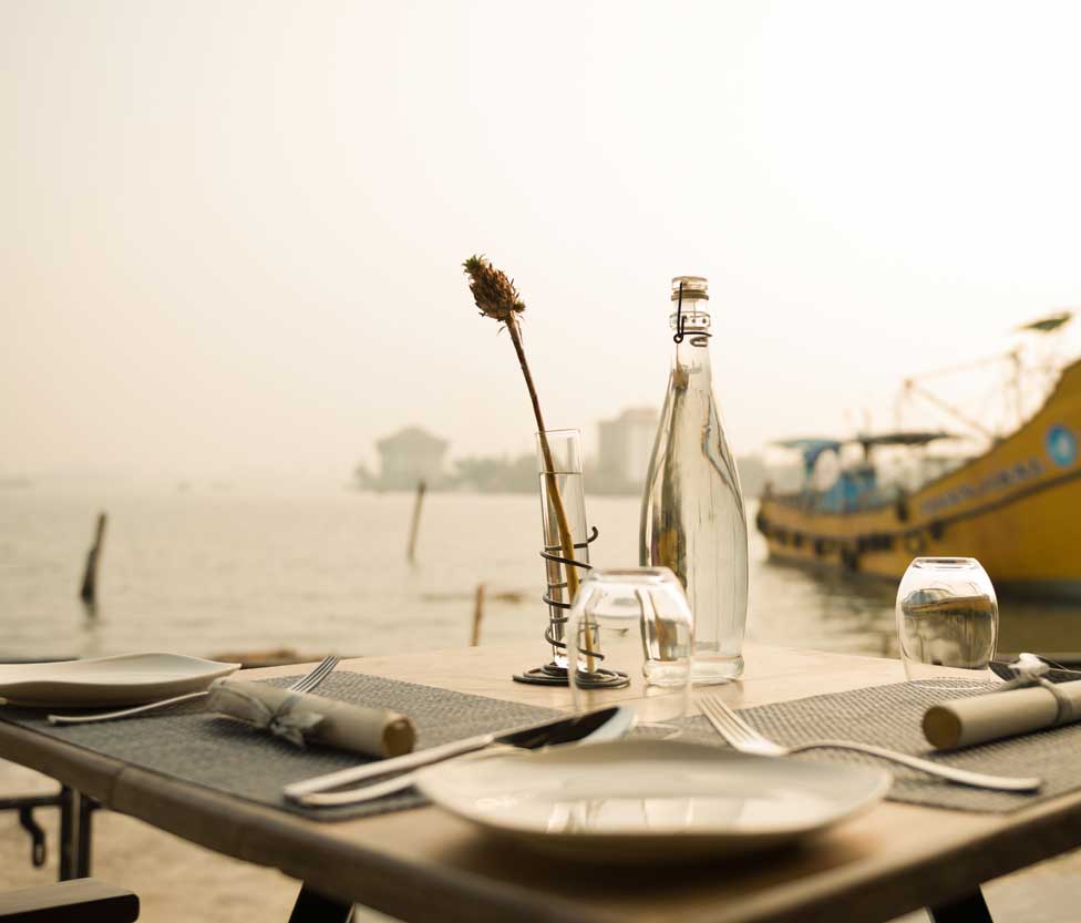 table setting facing the colorful boats
