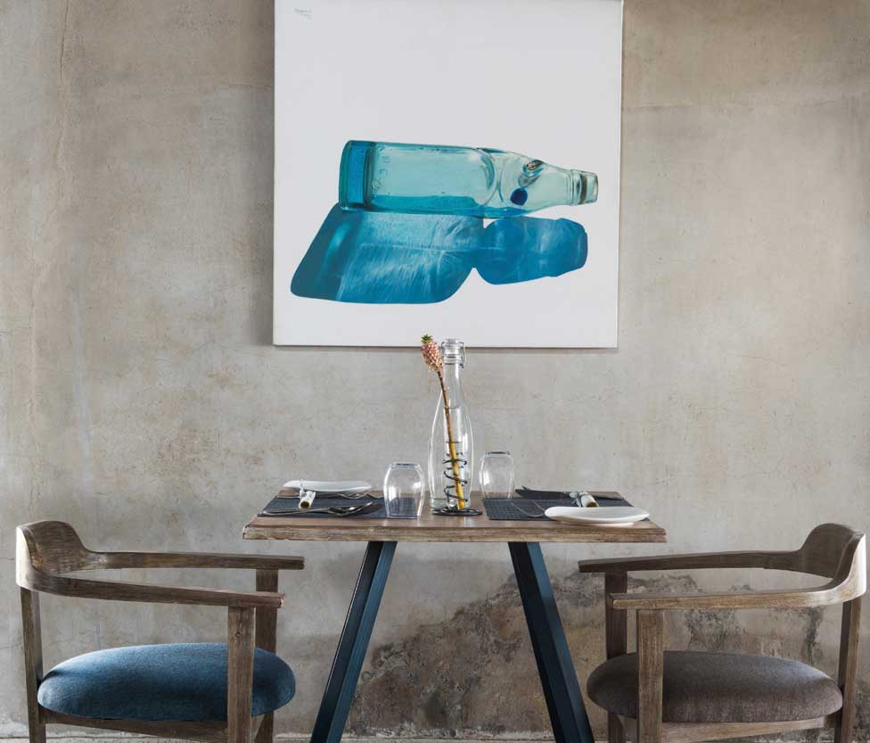 couple seating with a framed artwork